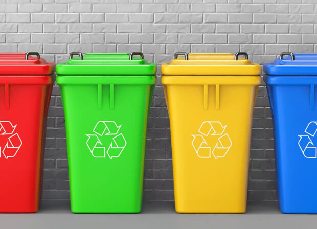 Recycling bins in red, green, yellow and blue